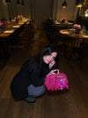 Borsa Étoile Rosa Thrilly con indossata da modella
